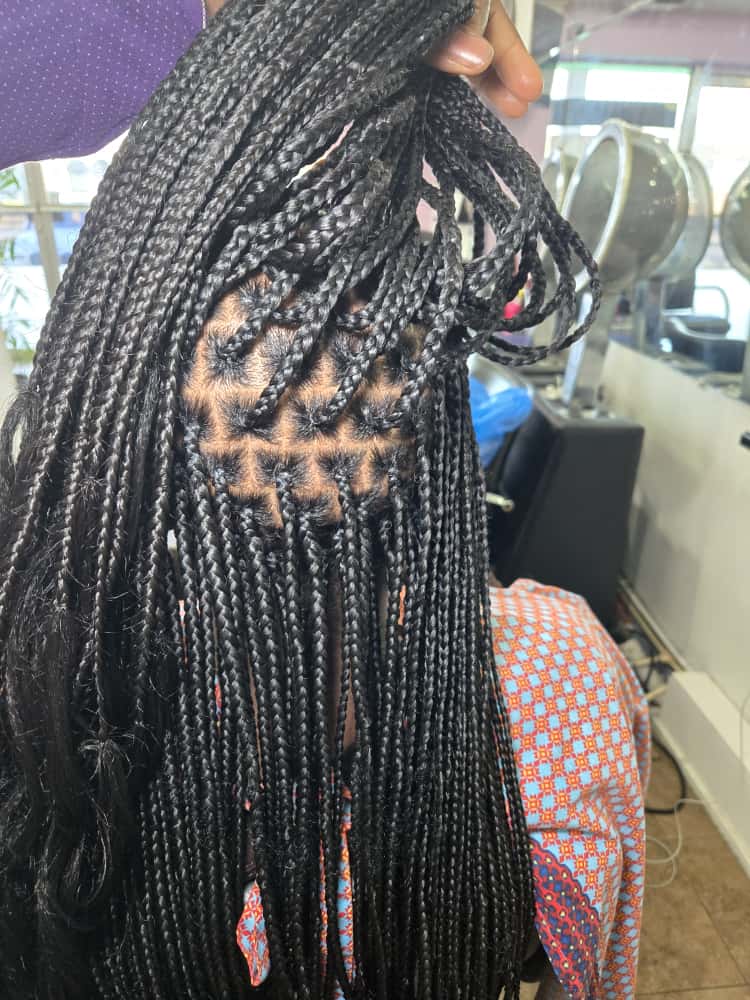 Box braids styled at Akwaba Hair Braiding